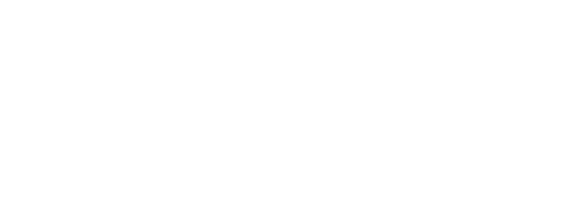 man on cliff with arms up